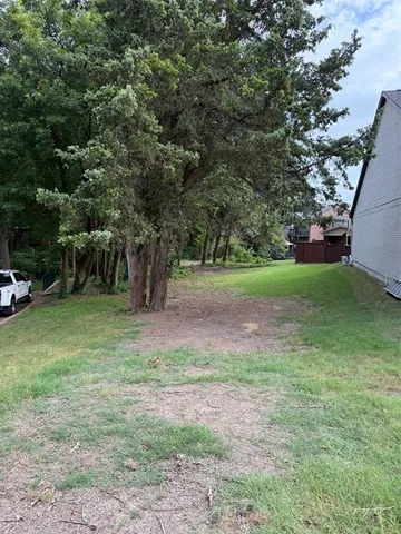 a view of outdoor space with deck and yard