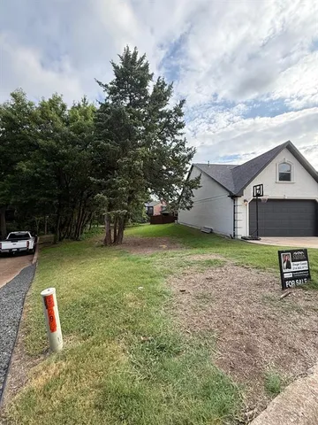 a house view with a garden space