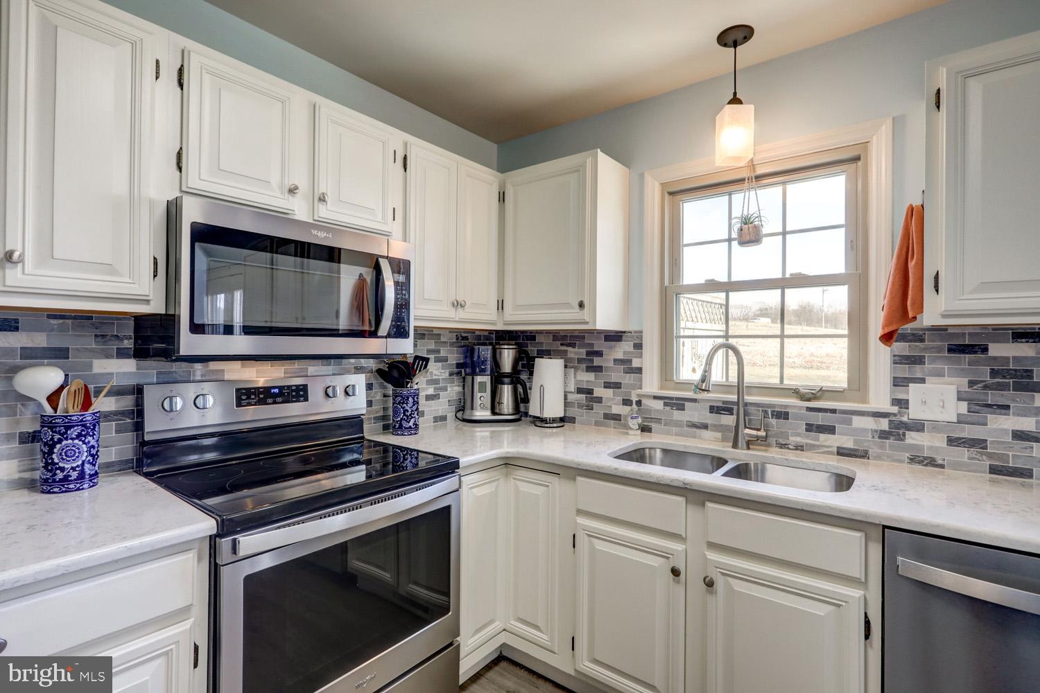34 Brookview Drive Lititz, PA 17543 - Photo 12 of 36 a kitchen with cabinets appliances a sink and a window