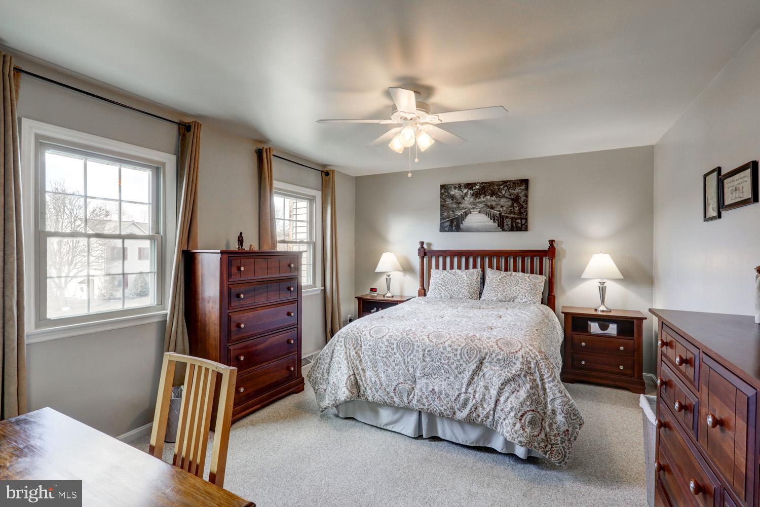 34 Brookview Drive Lititz, PA 17543 - Photo 16 of 36 a bedroom with a bed and a chandelier