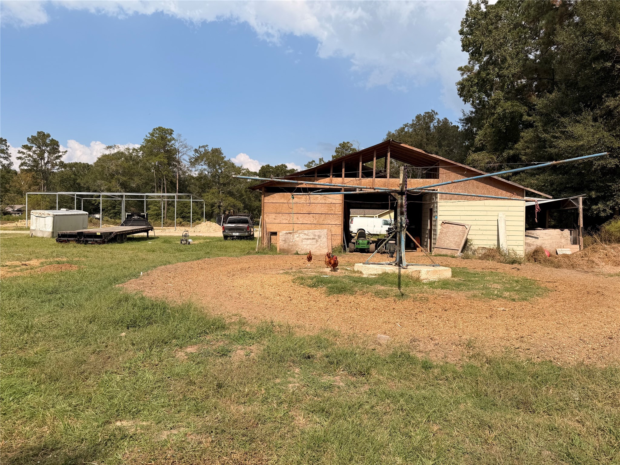 62 Short Leaf Drive Huffman, TX 77336 - Photo 26 of 33 a view of a house with pool and chairs next to a yard