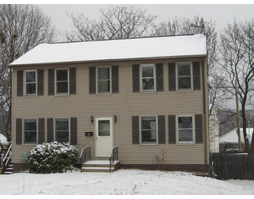 247 Plantation Street Worcester, MA 01604 - Photo 1 of 5 a front view of a house with a yard