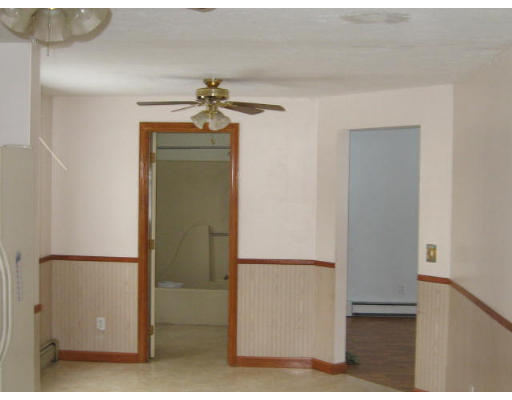 247 Plantation Street Worcester, MA 01604 - Photo 2 of 5 a view of a refrigerator in kitchen and an empty room