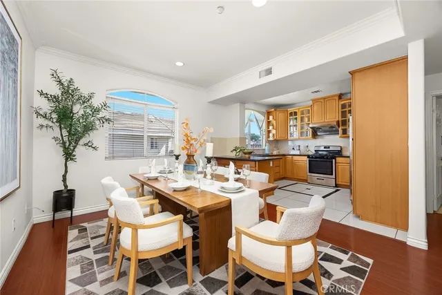 a view of a dining room with furniture and window