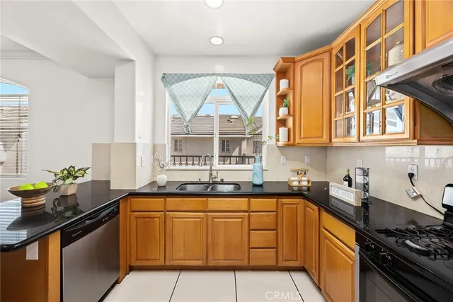 a utility room with sink dryer and washer