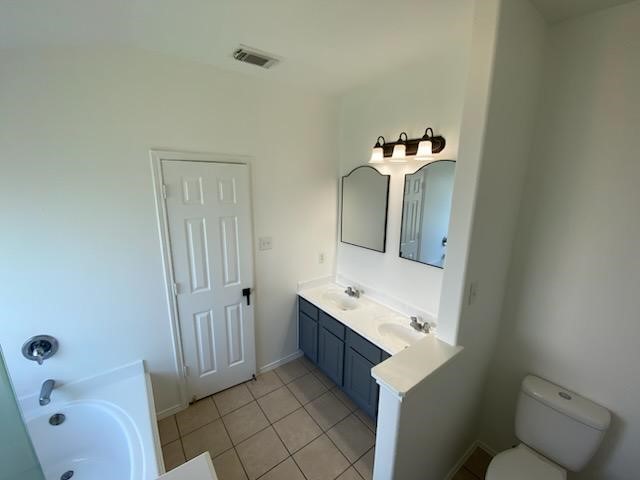 9530 Alex Springs Lane Houston, TX 77044 - Photo 3 of 8 a bathroom with a sink vanity and mirror