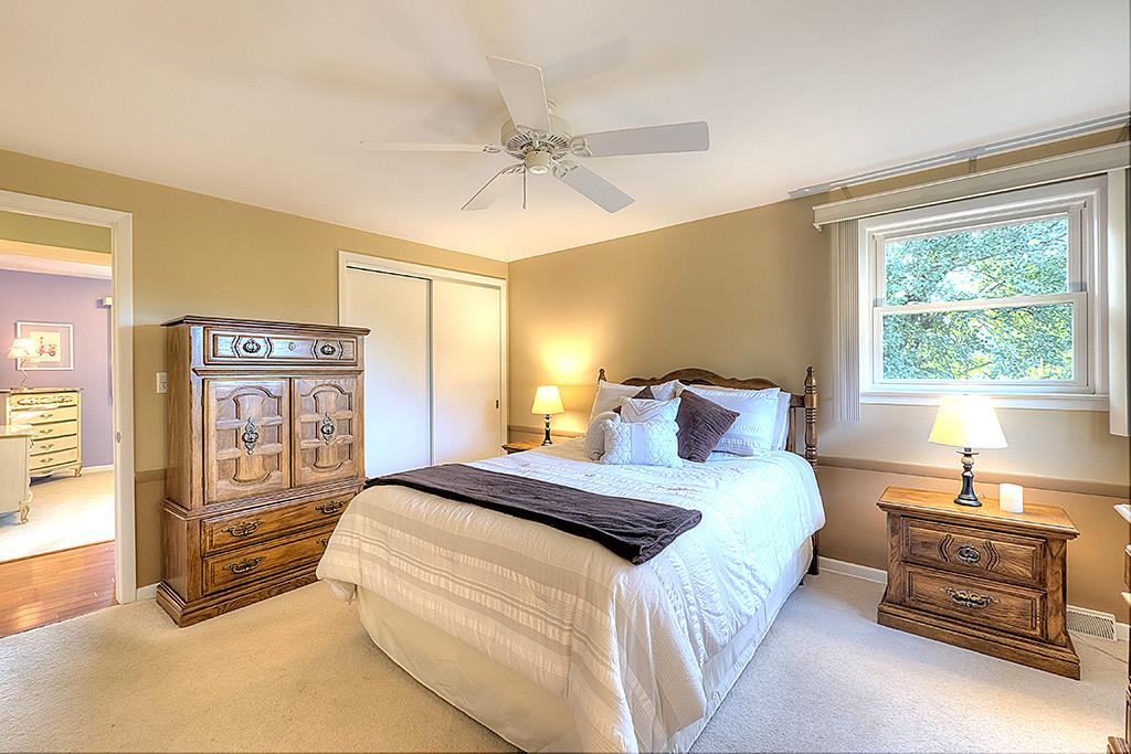 3506 North View Road Rockford, IL 61114 - Photo 14 of 25 a bedroom with a bed and wooden floor