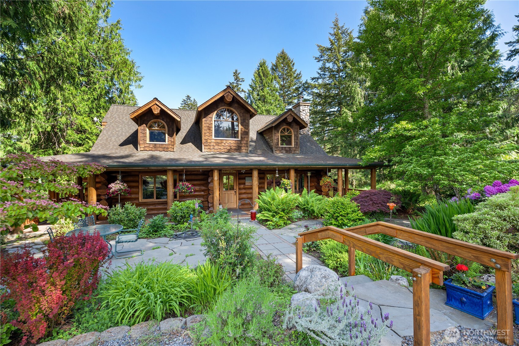 134 Sacred Moon Way Friday Harbor, WA 98250 - Photo 3 of 35 a front view of a house with a yard and potted plants