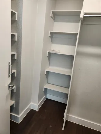 a storage room with wooden floor