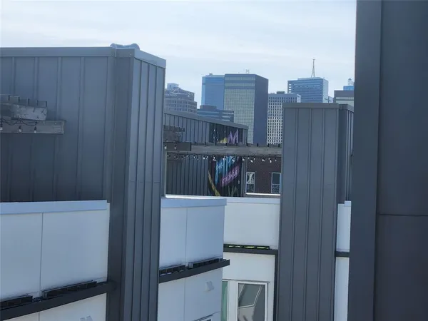 a view of a room with wooden cabinets