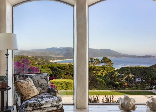 a view of a chairs and table on the wooden deck