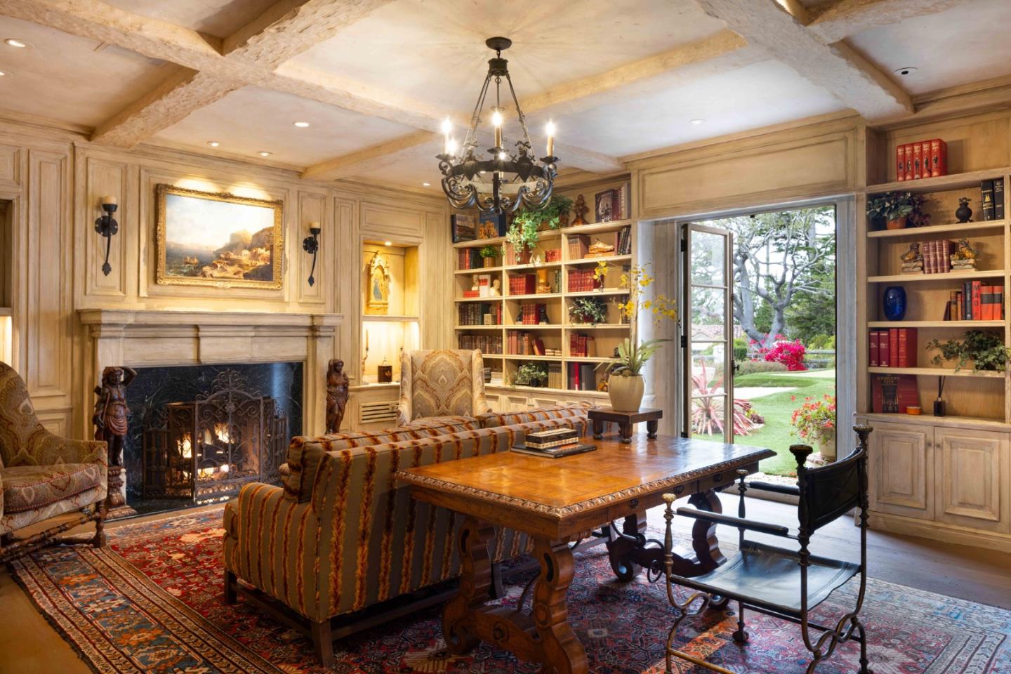 1463 Oleada Road Pebble Beach, CA 93953 - Photo 34 of 68 a living room with furniture a chandelier and a fireplace