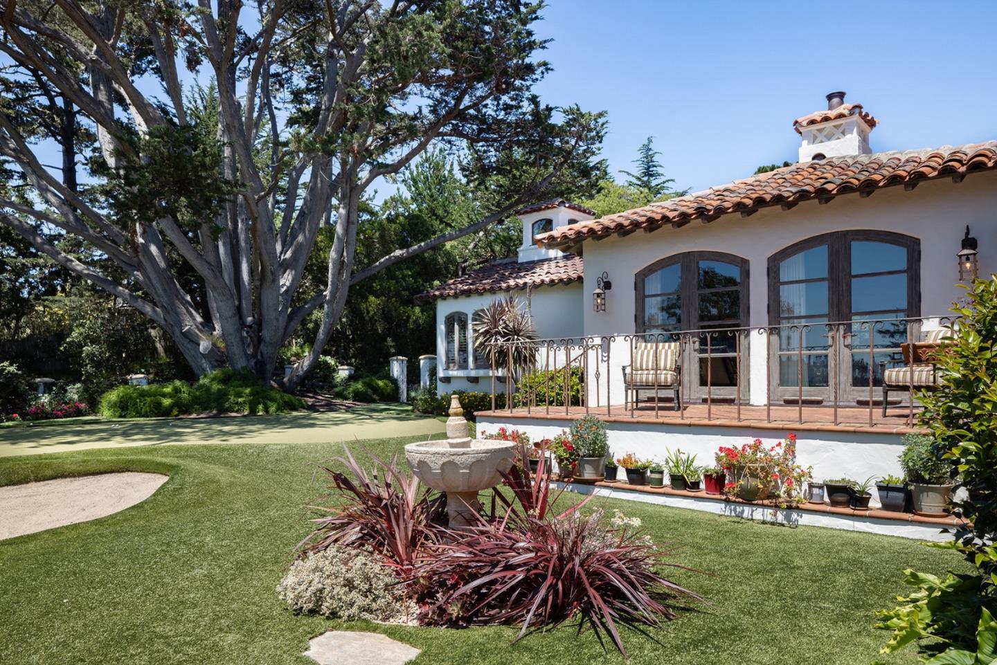 1463 Oleada Road Pebble Beach, CA 93953 - Photo 35 of 68 front view of a house with a yard