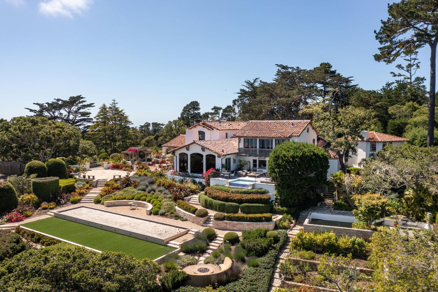 1463 Oleada Road Pebble Beach, CA 93953 - Photo 7 of 68 a view of a house with swimming pool and chairs