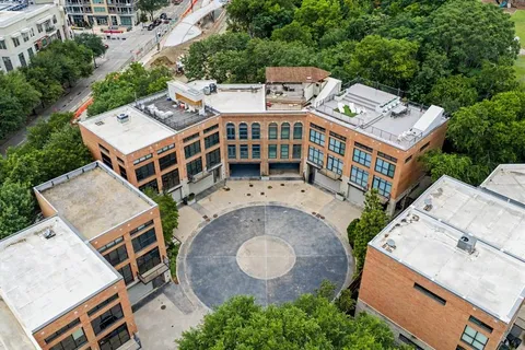 a view of building with a window and balcony