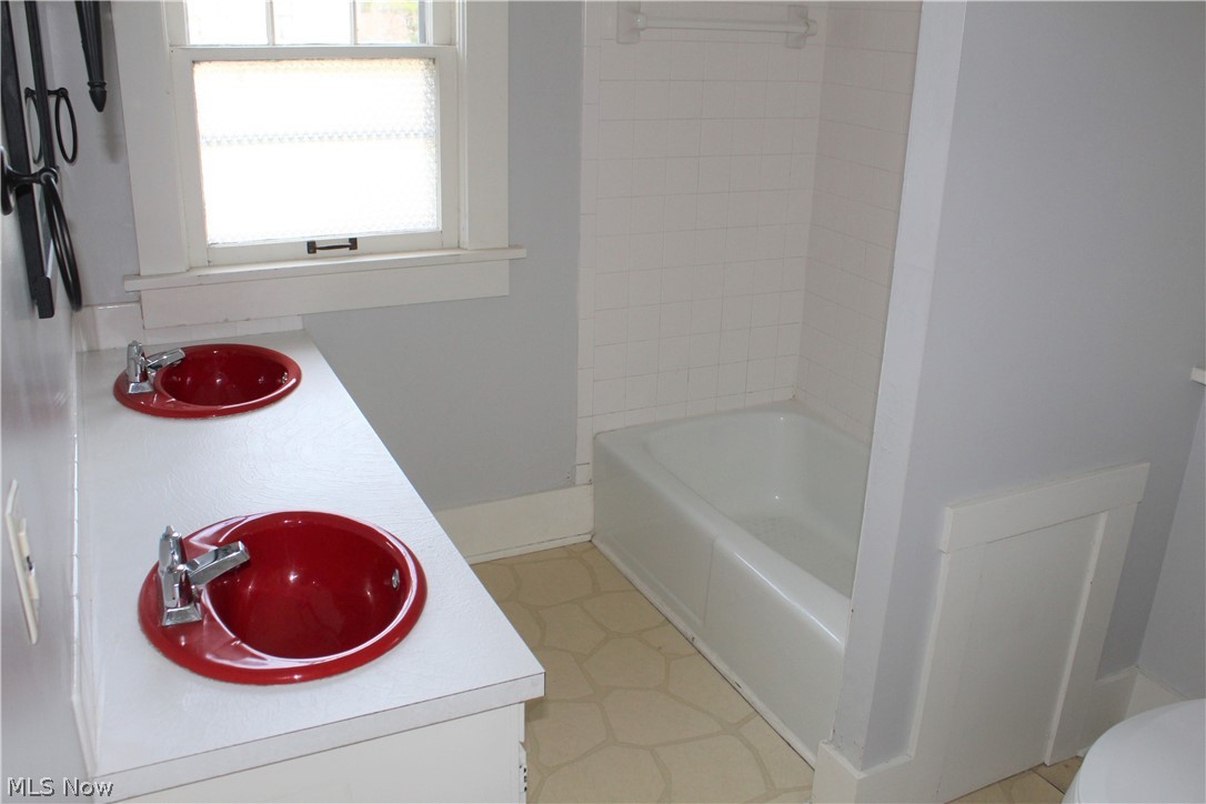 3904 Kent Road Stow, OH 44224 - Photo 18 of 35 Main bathroom features plenty of space and retro sinks!
