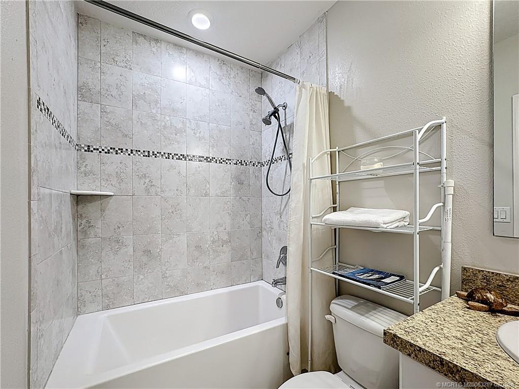 4341 Southwest Appleseed Road Port St. Lucie, FL 34953 - Photo 13 of 25 a bathroom with a bath tub and a shower