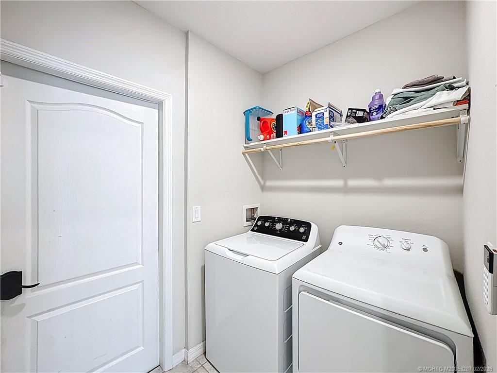 4341 Southwest Appleseed Road Port St. Lucie, FL 34953 - Photo 14 of 25 a utility room with dryer and washer