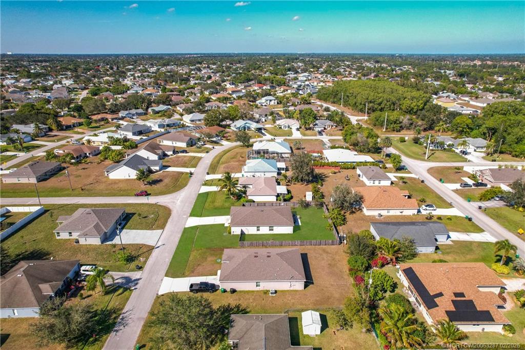 4341 Southwest Appleseed Road Port St. Lucie, FL 34953 - Photo 20 of 25 an aerial view of residential houses with outdoor space