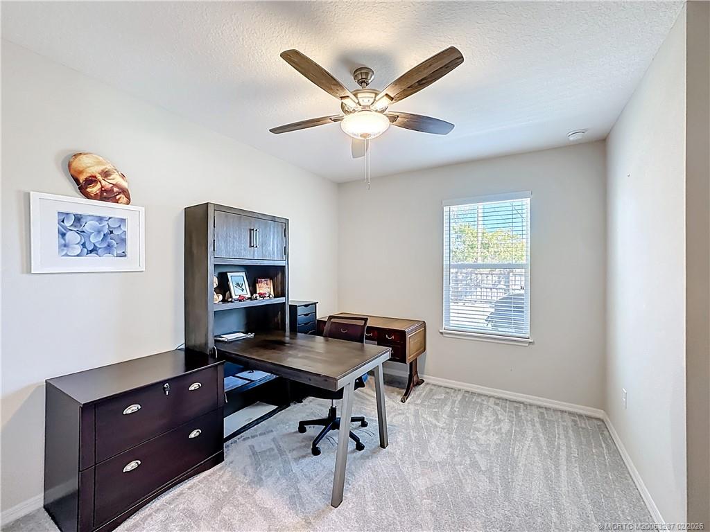 4341 Southwest Appleseed Road Port St. Lucie, FL 34953 - Photo 5 of 25 a workspace with furniture and window