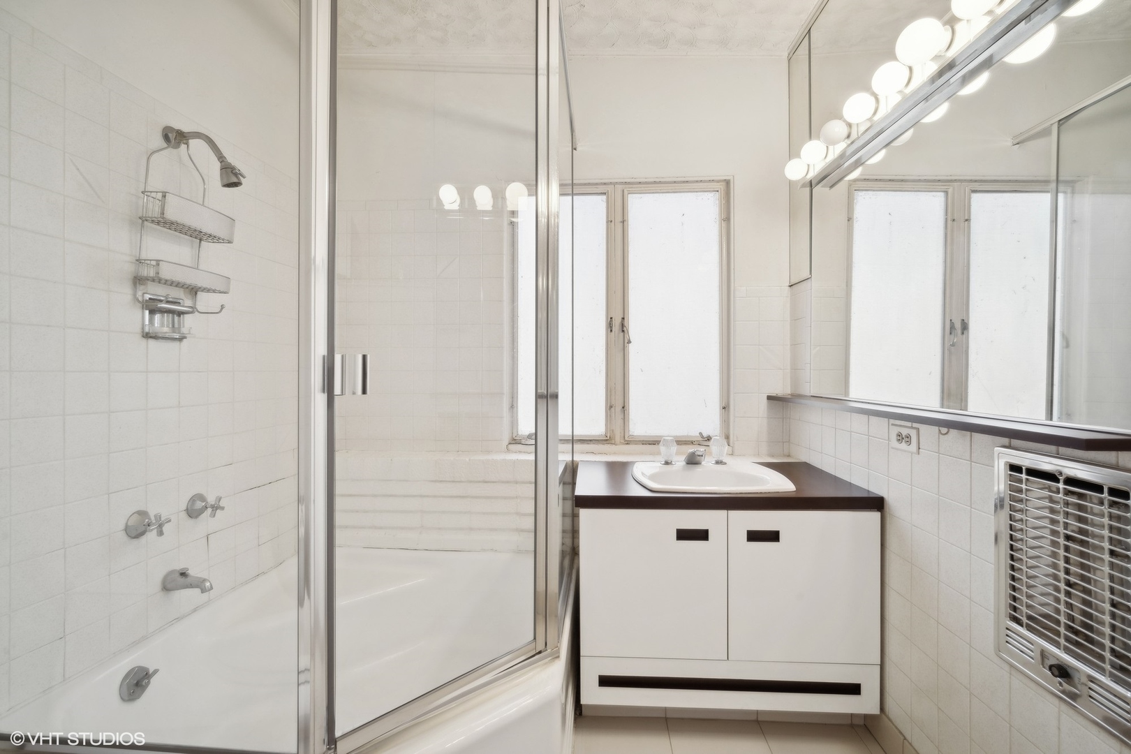800 Edgewood Lane Glenview, IL 60025 - Photo 19 of 20 a bathroom with a granite countertop sink a mirror and a shower