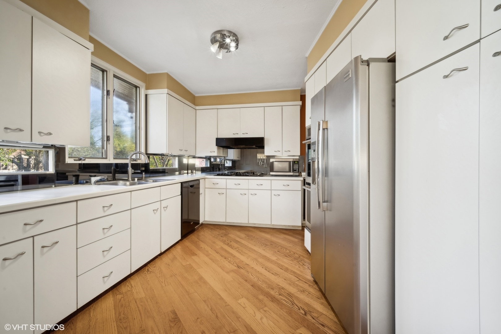 800 Edgewood Lane Glenview, IL 60025 - Photo 8 of 20 a kitchen with white cabinets and white appliances