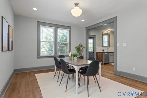 a kitchen with stainless steel appliances a sink stove and cabinets