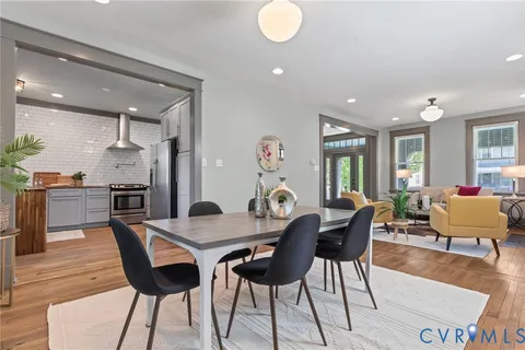 a kitchen with stainless steel appliances a stove sink and cabinets