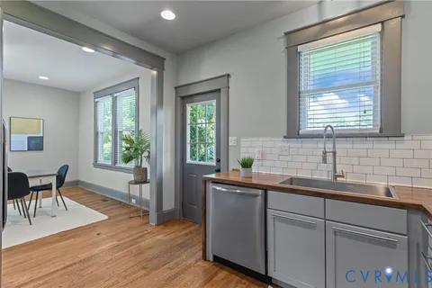 a bathroom with a sink a mirror and a shower