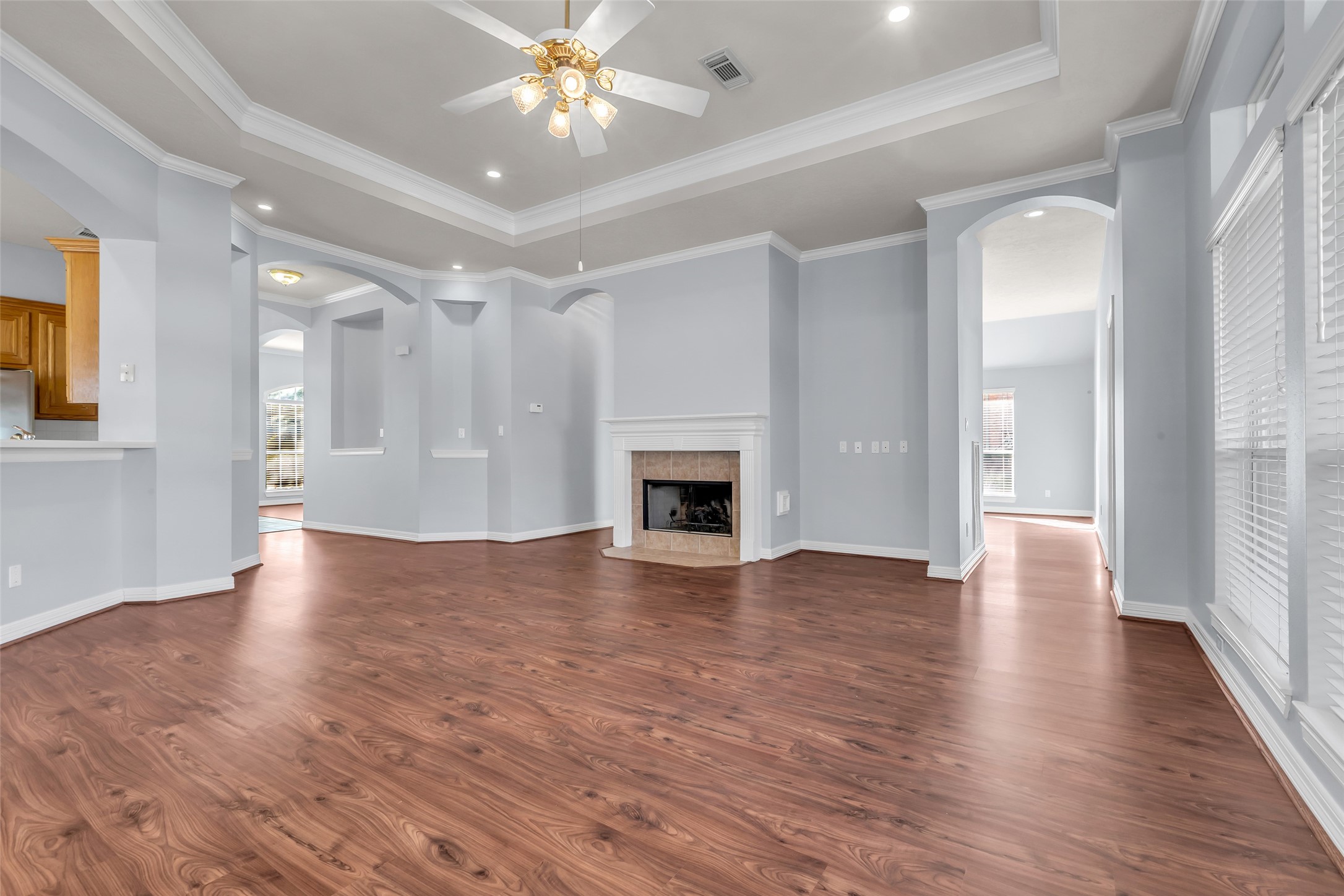 35 West Pines Drive Montgomery, TX 77356 - Photo 11 of 30 a view of an empty room with wooden floor and a fireplace