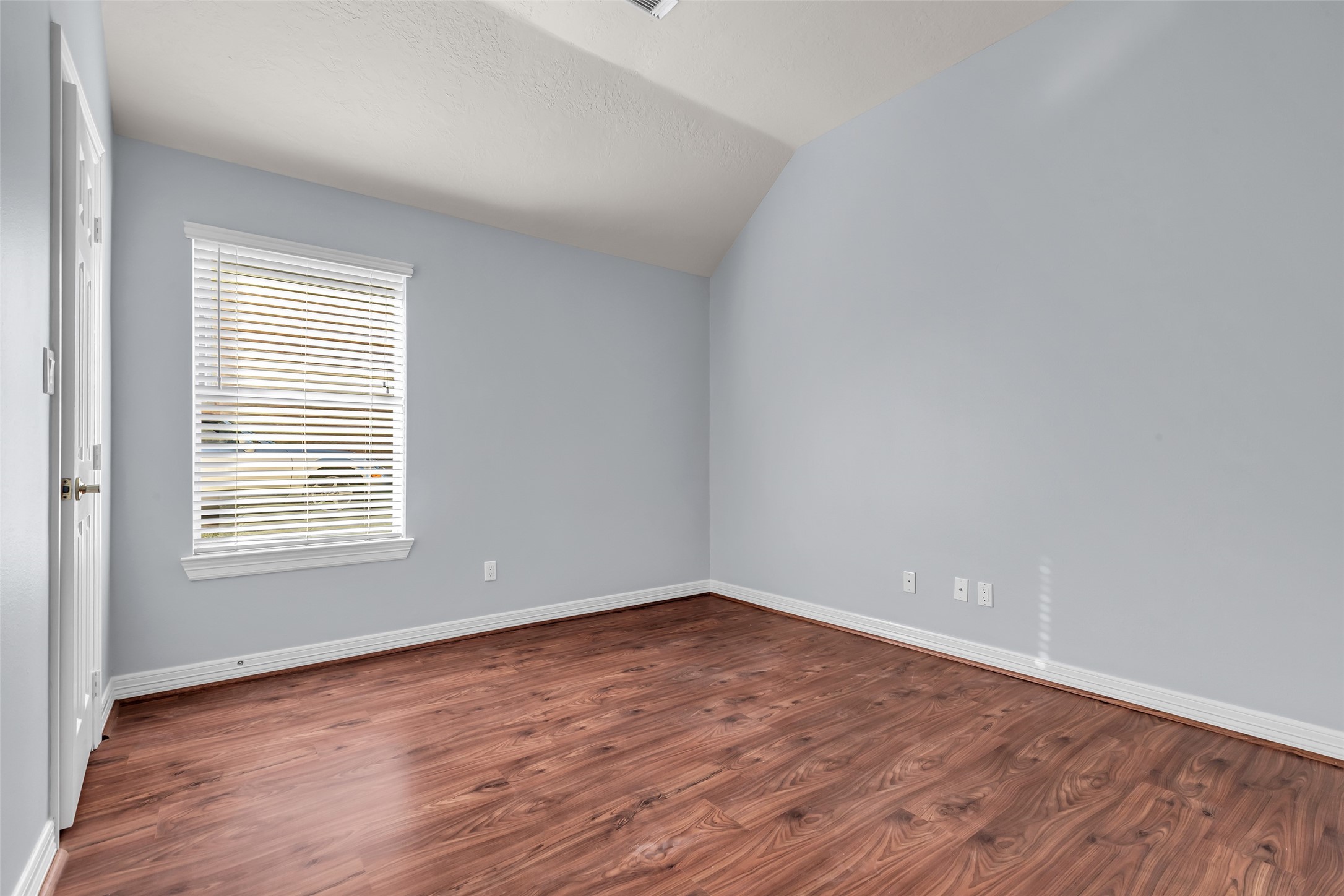 35 West Pines Drive Montgomery, TX 77356 - Photo 19 of 30 a view of an empty room with wooden floor and a window