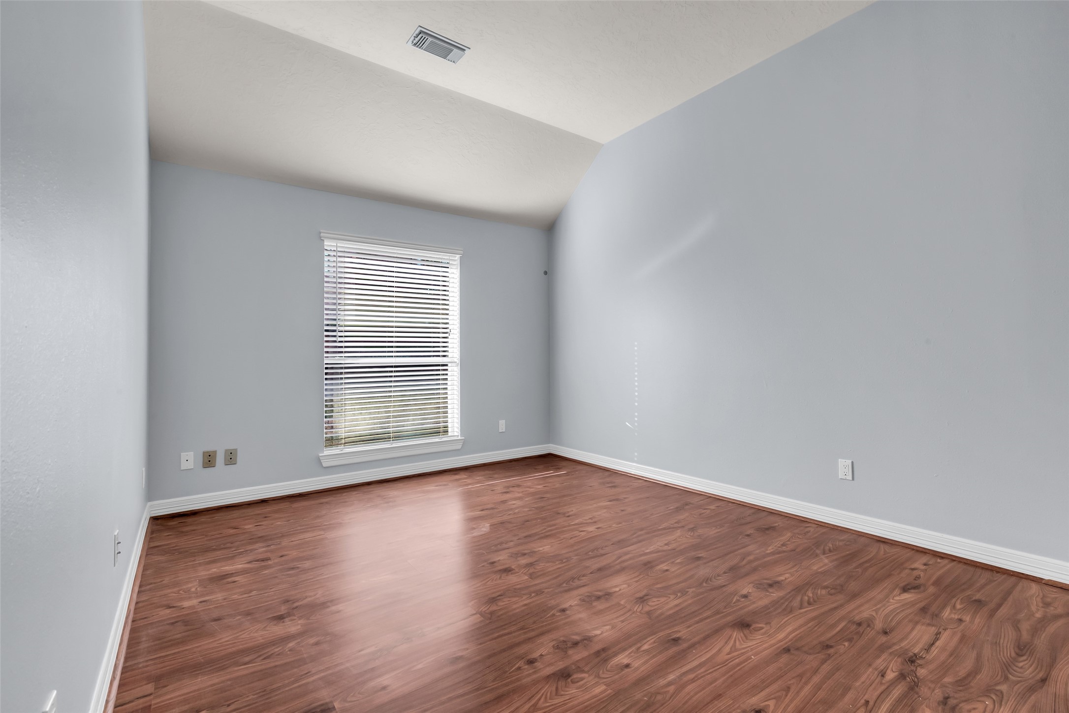 35 West Pines Drive Montgomery, TX 77356 - Photo 20 of 30 a view of an empty room with wooden floor and a window