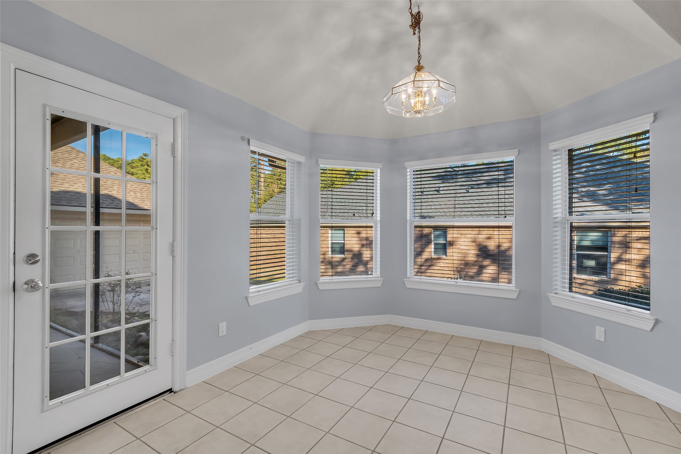 35 West Pines Drive Montgomery, TX 77356 - Photo 7 of 30 a view of an empty room with window and chandelier fan