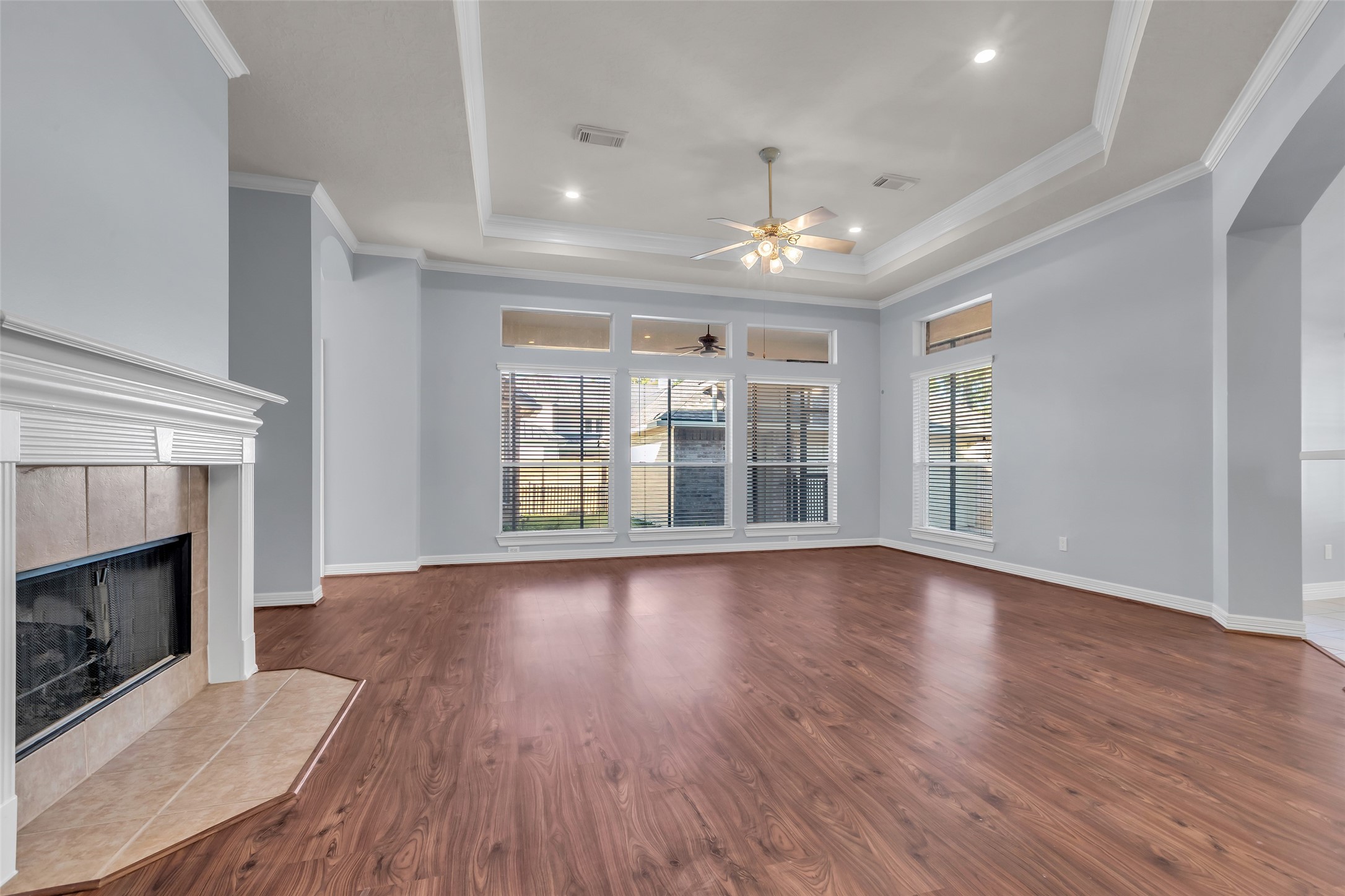 35 West Pines Drive Montgomery, TX 77356 - Photo 9 of 30 a view of an empty room with wooden floor fireplace and a window