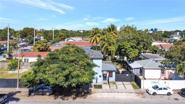 an aerial view of a house with a garden