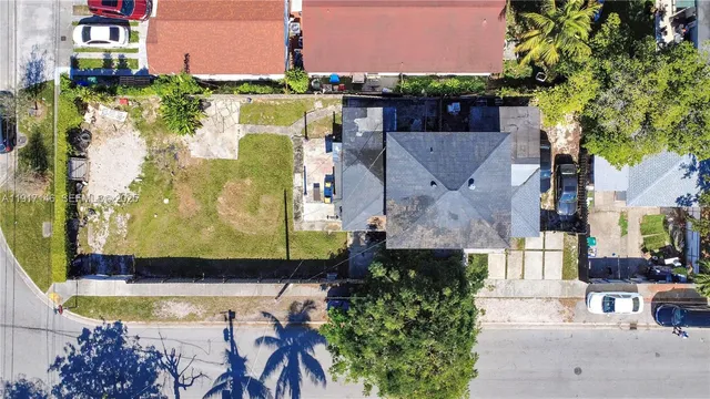 an aerial view of a house with swimming pool