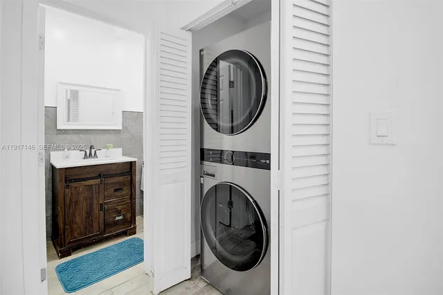 a bathroom with a sink and a washing machine