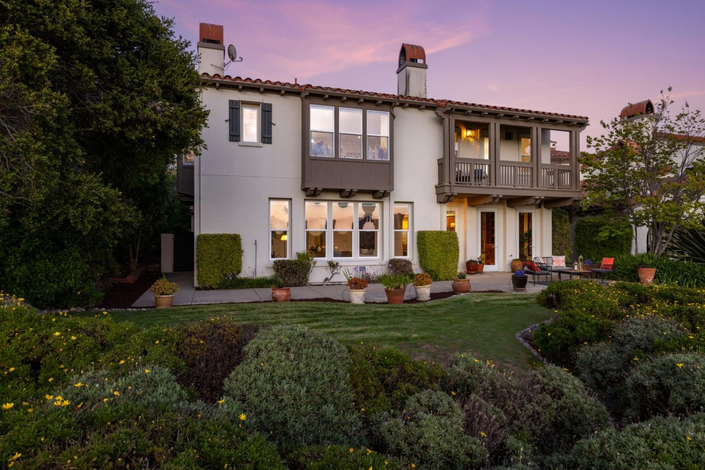 302 Pasadera Drive Monterey, CA 93940 - Photo 36 of 40 a front view of a house with a yard porch and outdoor seating