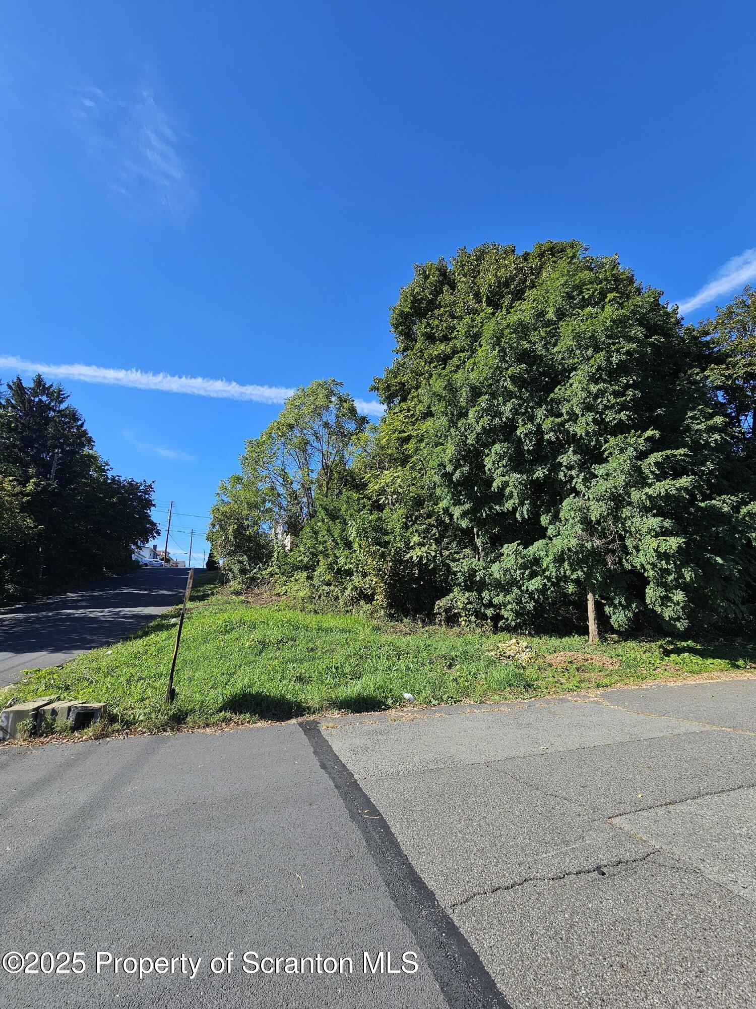 a view of a road with a building in the background