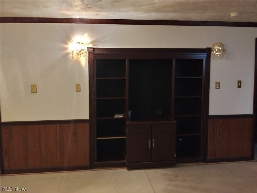 1423 Walnut Road Southeast Massillon, OH 44646 - Photo 21 of 30 Rec room with custom built in shelving and lighting