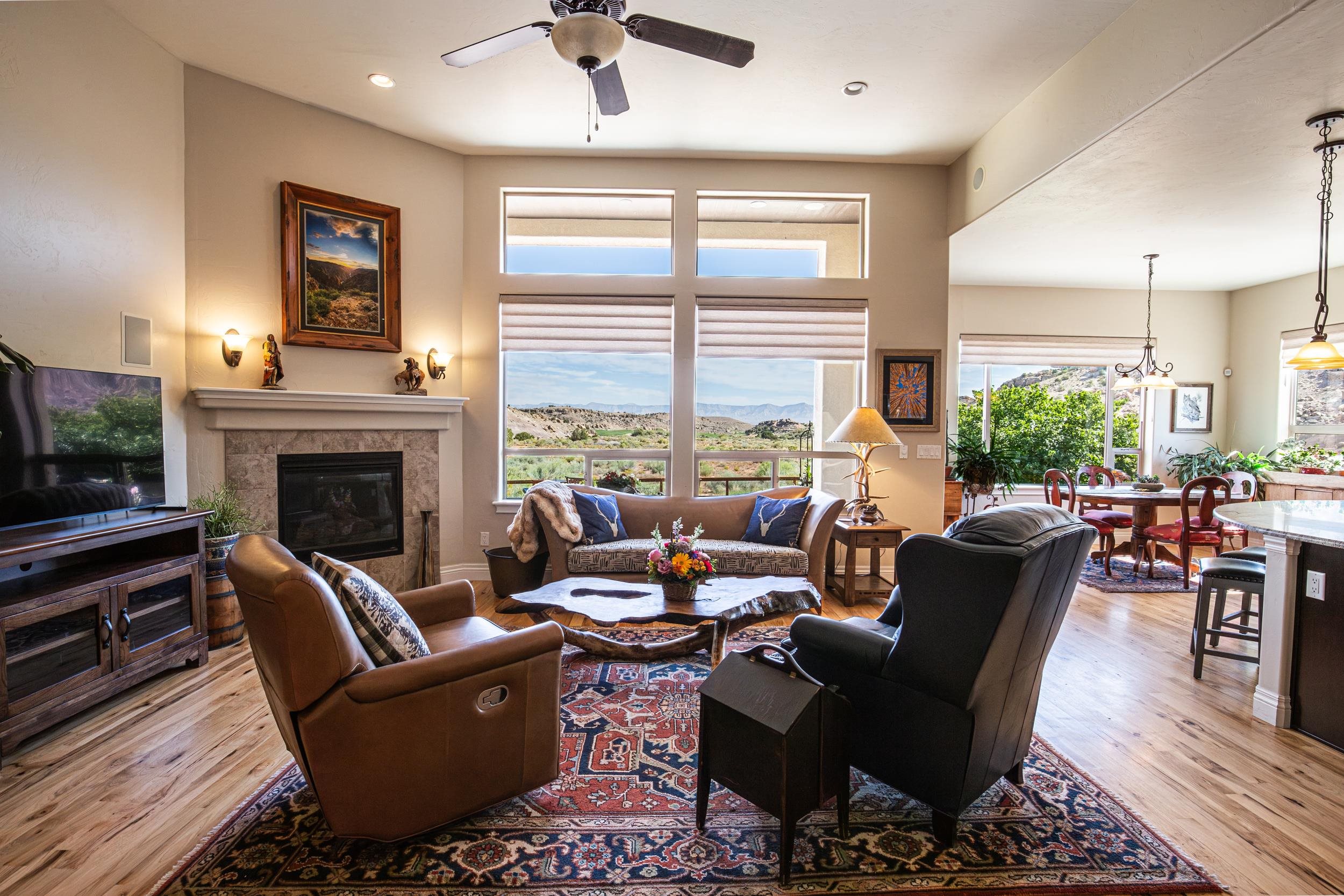 326 Red Point Road Grand Junction, CO 81507 - Photo 13 of 37 a living room with furniture fireplace and a large window