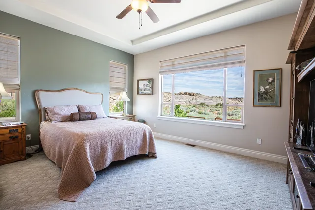 a bedroom with a large bed and a window