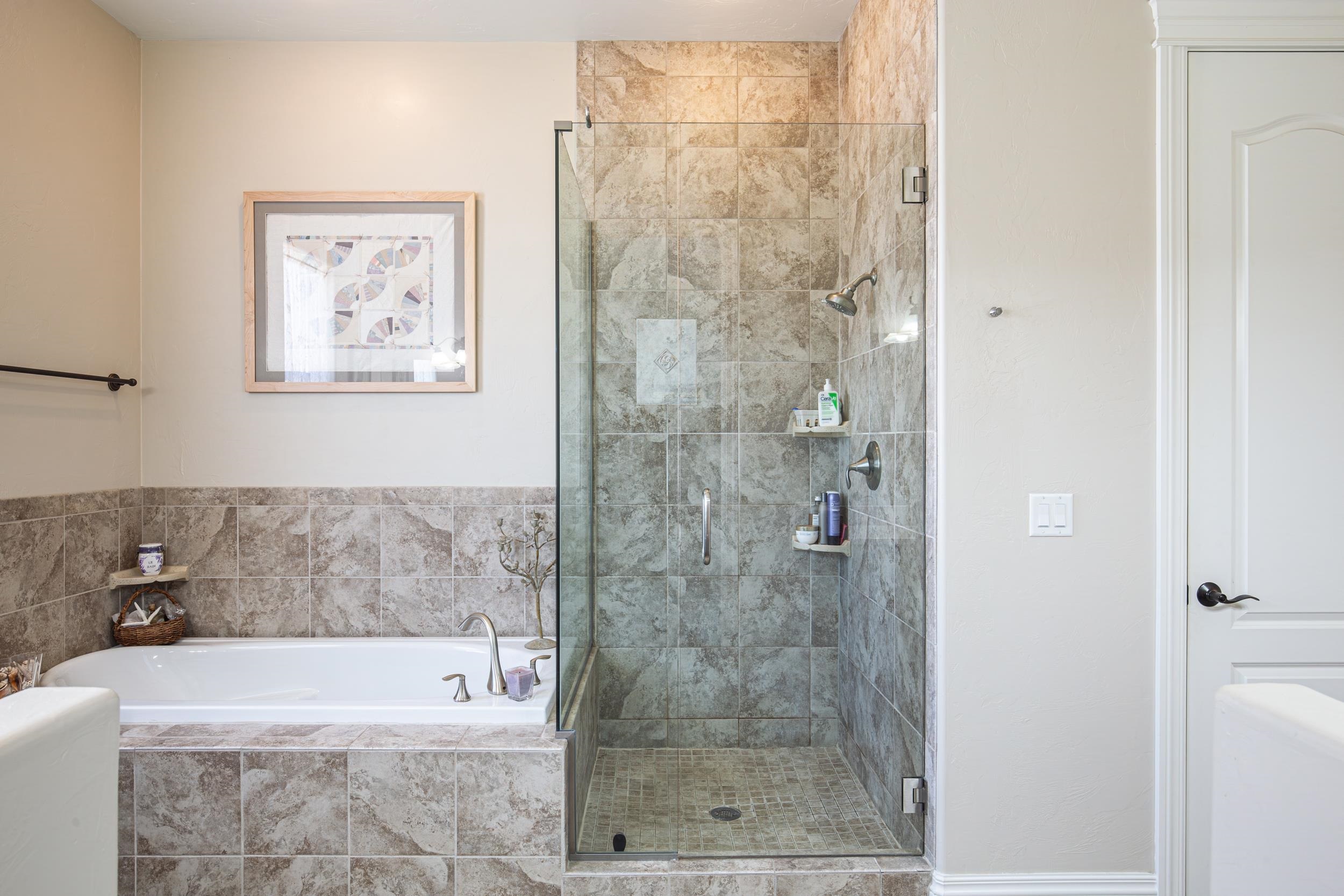 326 Red Point Road Grand Junction, CO 81507 - Photo 19 of 37 a bathroom with a bathtub and a shower