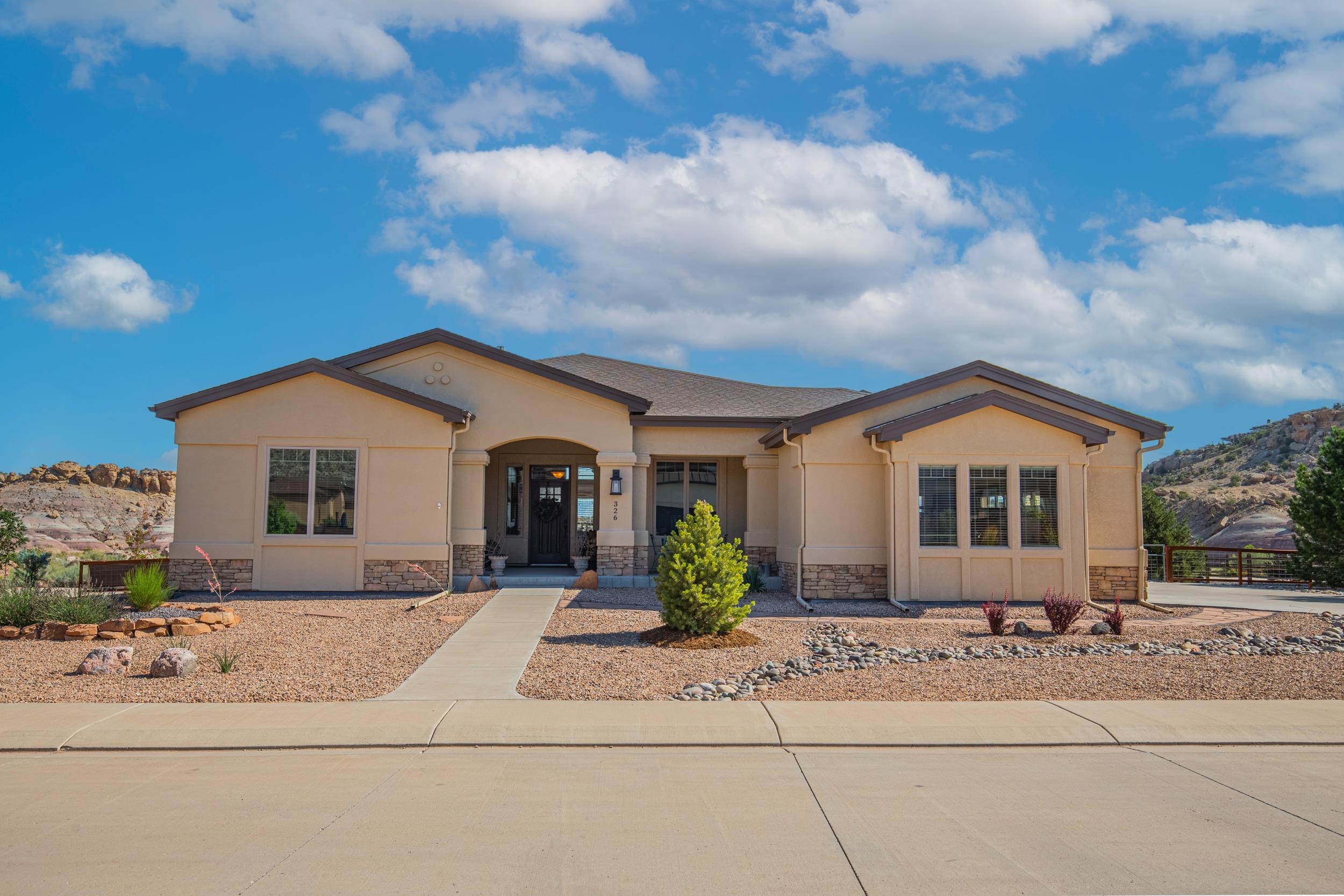 326 Red Point Road Grand Junction, CO 81507 - Photo 2 of 37 a front view of a house with porch