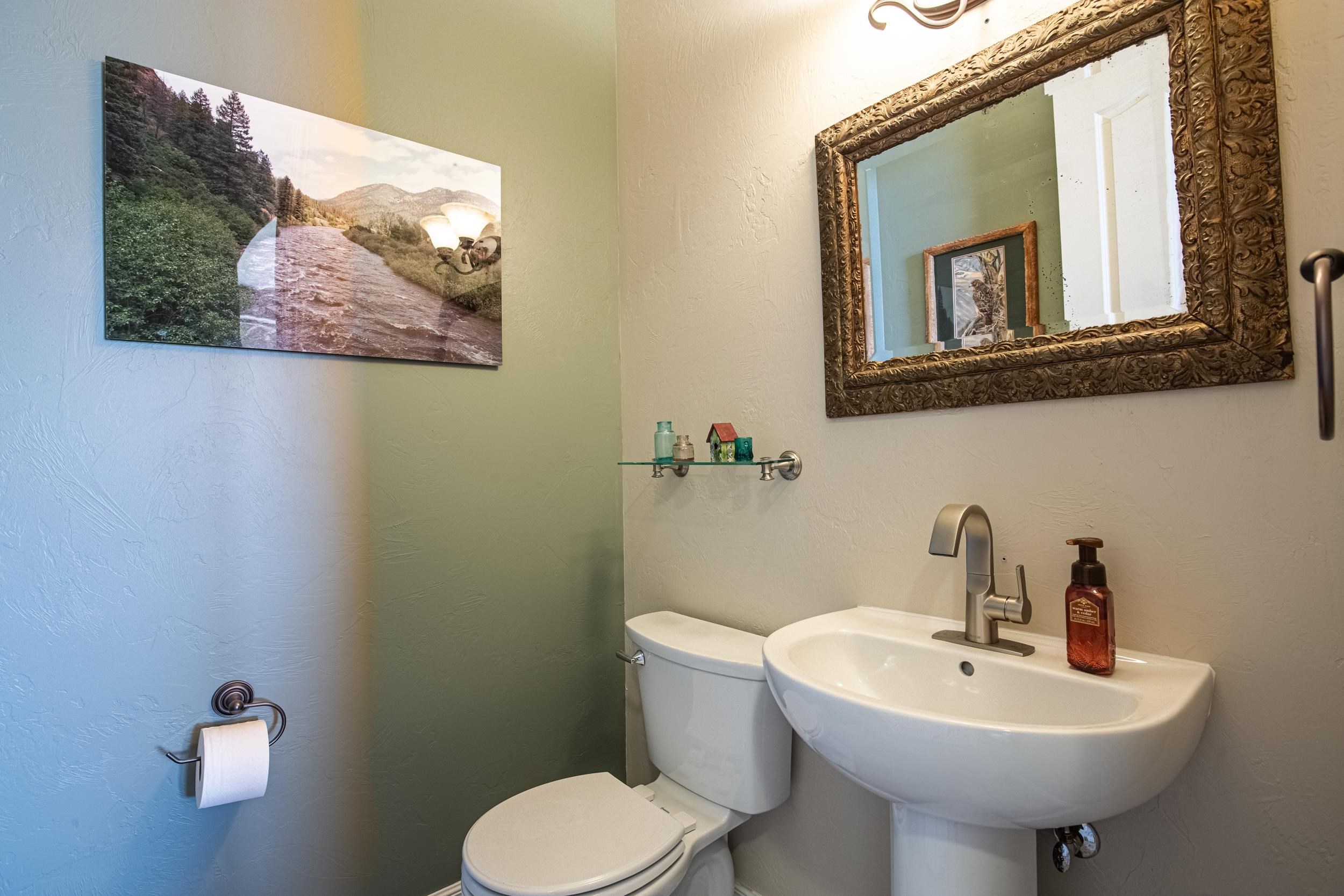 326 Red Point Road Grand Junction, CO 81507 - Photo 28 of 37 a bathroom with a toilet sink and mirror