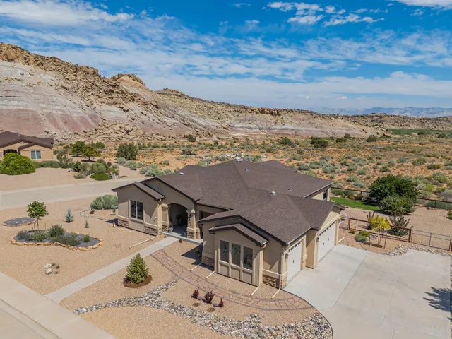 a aerial view of a house with a mountain