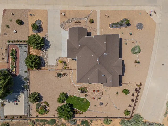 an aerial view of a house with a car park