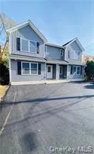 a front view of residential houses with yard