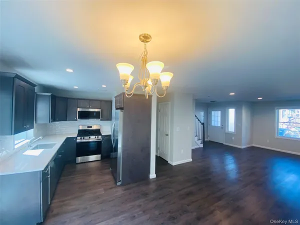 a view of a kitchen and a sink
