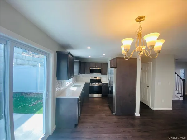 a view of a living room and chandelier